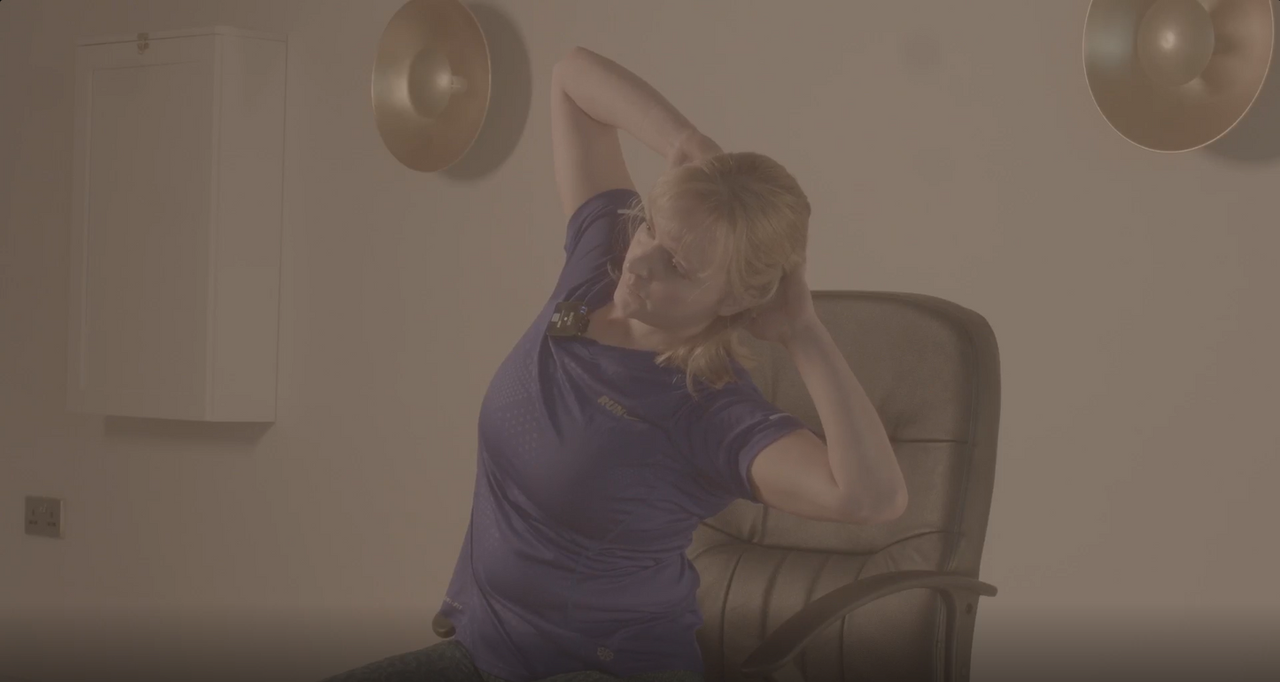 Close up shot of an instructor performing one of our seated hernia rehabilitation exercises.